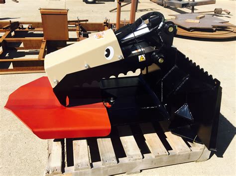 DANIEL MFG The Beak concrete grapple for skid steer loaders